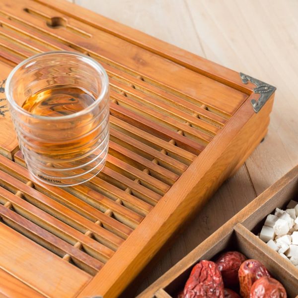 Chinese Herbal Medicine with a cup of tea on table.